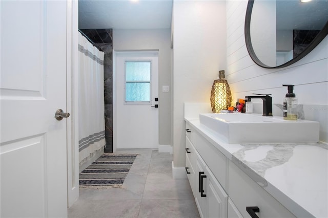 bathroom featuring vanity and a shower with shower curtain