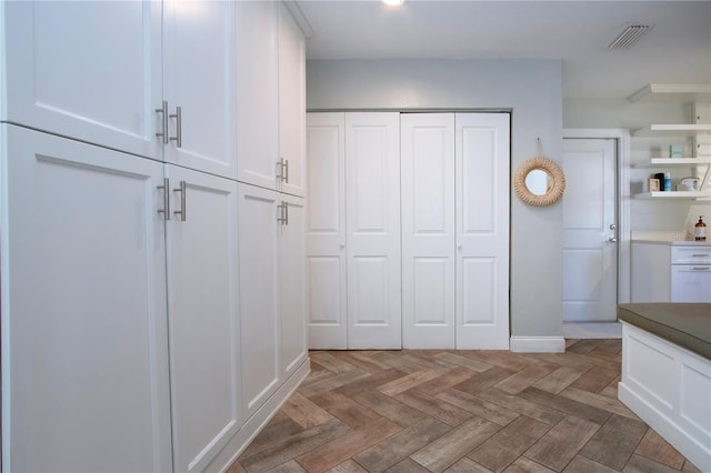 mudroom with parquet floors