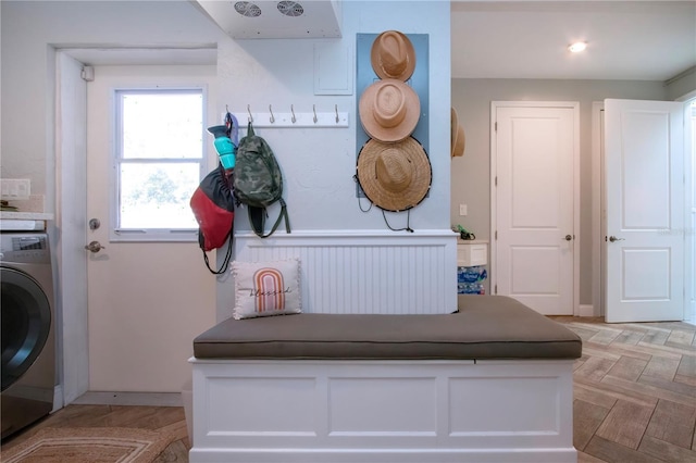 interior space featuring light parquet flooring and washer / dryer