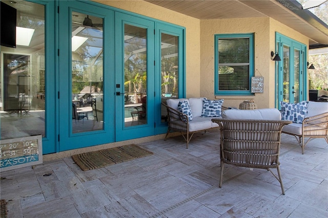 view of patio with an outdoor living space and french doors