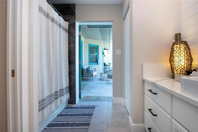 bathroom with vanity and tile patterned flooring