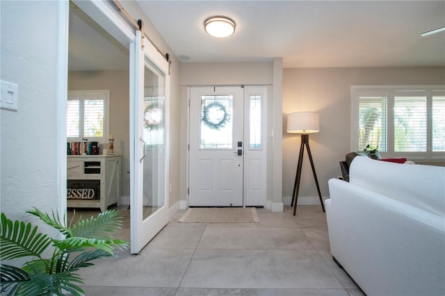 foyer entrance featuring a barn door