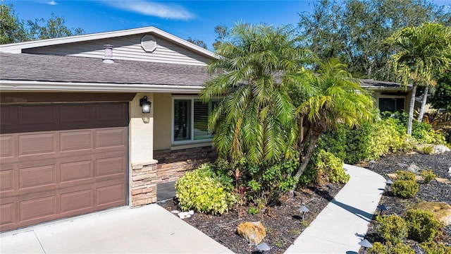 ranch-style house featuring a garage