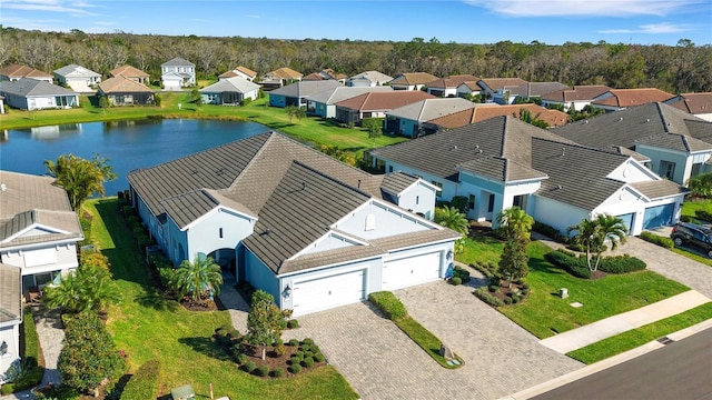 bird's eye view with a water view and a residential view