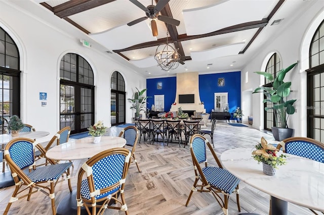 dining area featuring beam ceiling, french doors, recessed lighting, visible vents, and a high ceiling