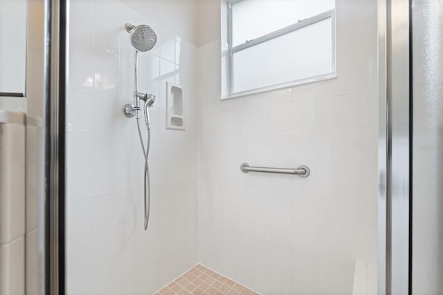 bathroom with tiled shower