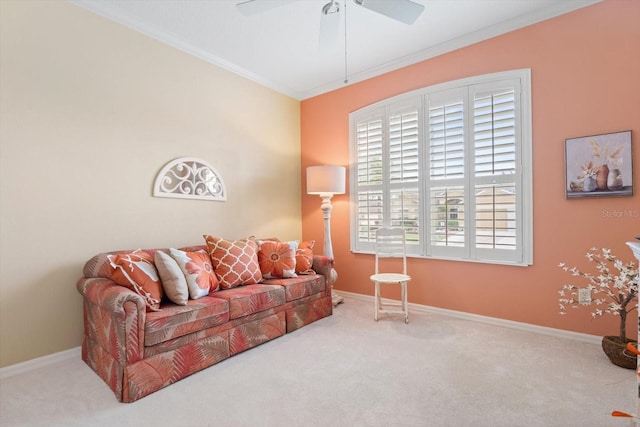 carpeted living room with crown molding and ceiling fan