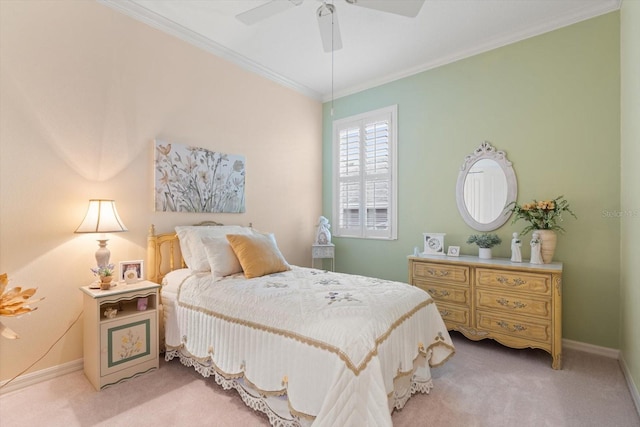 carpeted bedroom featuring ceiling fan and ornamental molding