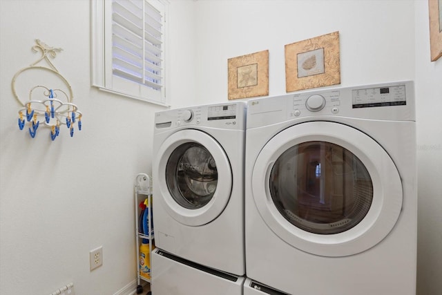 laundry area with washing machine and dryer