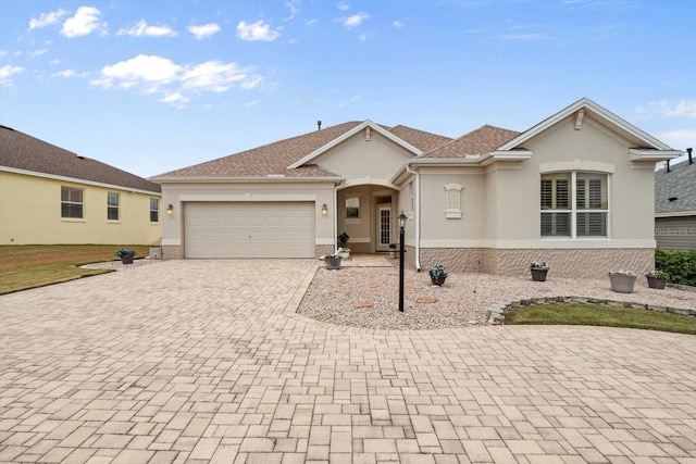 single story home featuring a garage