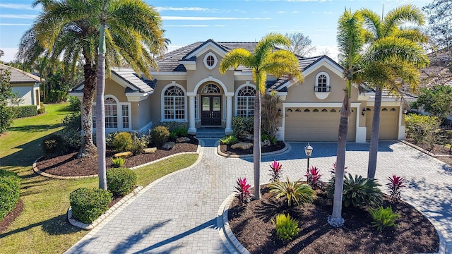 view of front of home with a garage and a front yard