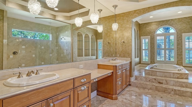 bathroom with vanity, ornamental molding, and separate shower and tub