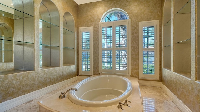 bathroom with tiled tub