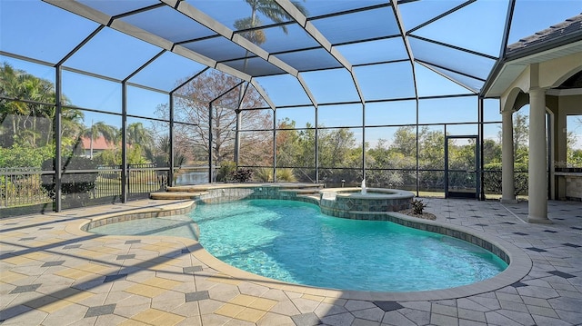 view of pool featuring an in ground hot tub, a lanai, and a patio