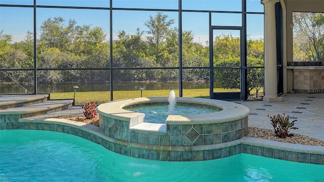 view of swimming pool with a water view, an in ground hot tub, a lanai, and pool water feature