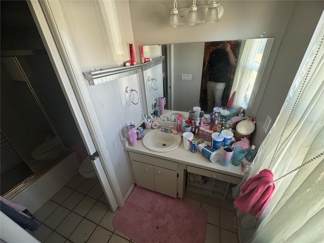 bathroom featuring vanity, tile patterned floors, and a shower with shower door