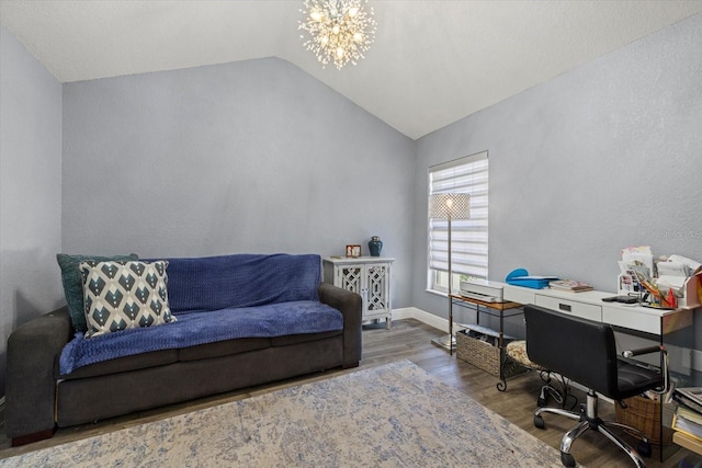 office featuring lofted ceiling, a notable chandelier, and wood-type flooring