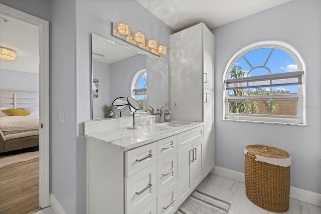 bathroom with vanity and a wealth of natural light