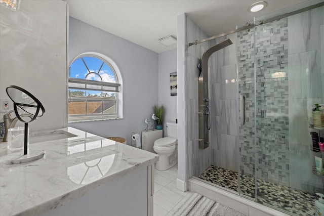 bathroom with vanity, an enclosed shower, tile patterned flooring, and toilet