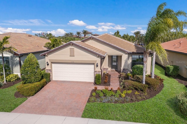 single story home featuring a garage and a front lawn