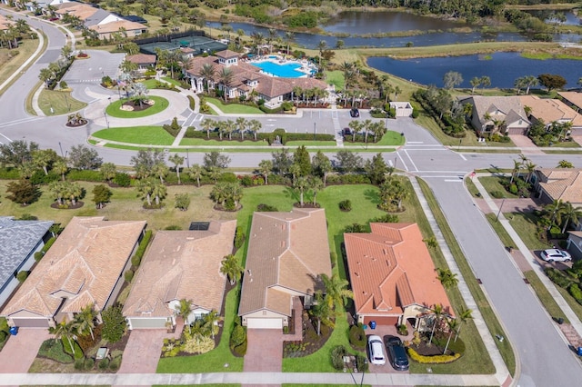 birds eye view of property with a water view