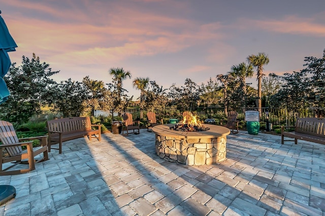 patio terrace at dusk with an outdoor fire pit