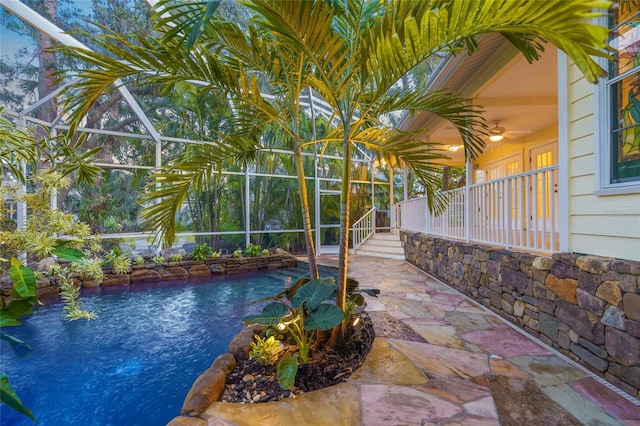 view of pool with a pool, a lanai, and a patio area