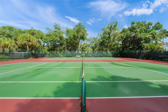 view of sport court with fence