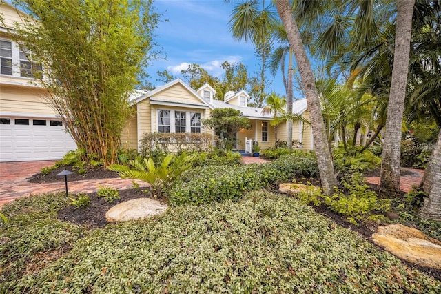 view of front of home with decorative driveway