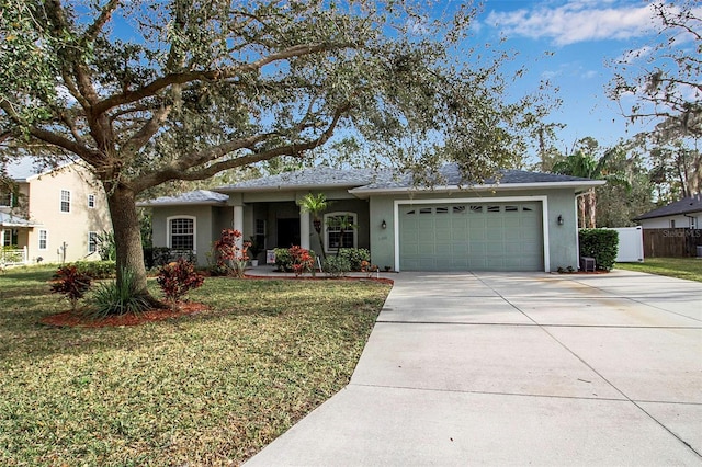 view of front of property featuring a garage and a front yard