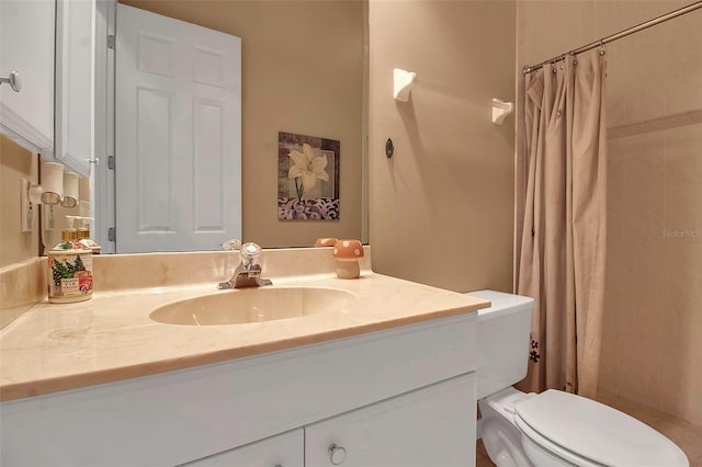 bathroom with walk in shower, vanity, and toilet