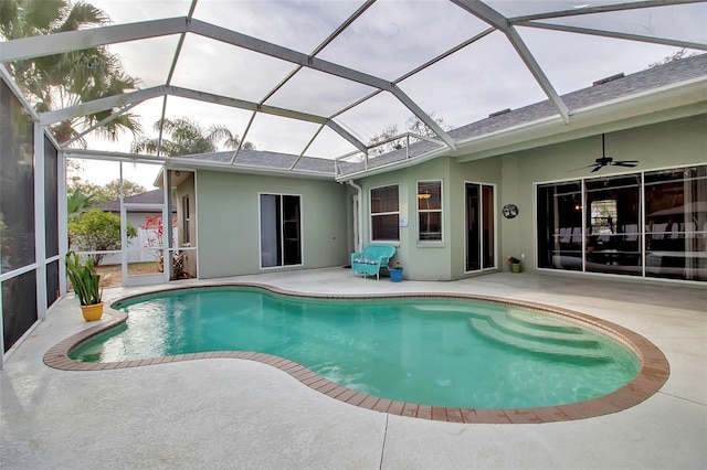 view of swimming pool featuring a patio, a lanai, and ceiling fan