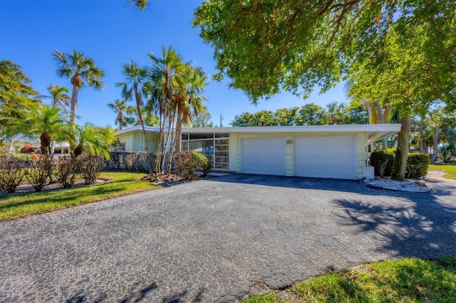 single story home with a garage