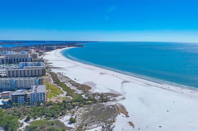 aerial view featuring a view of the beach and a water view