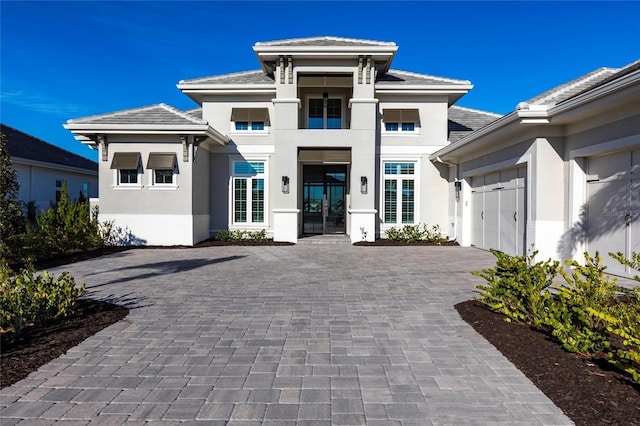 prairie-style house featuring a garage