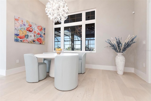 dining room featuring hardwood / wood-style floors and a notable chandelier