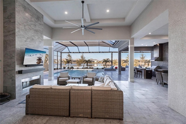 view of patio with an outdoor hangout area, an outdoor bar, ceiling fan, and glass enclosure