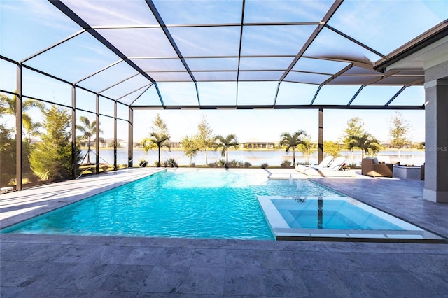 view of swimming pool featuring a water view, a patio area, and glass enclosure