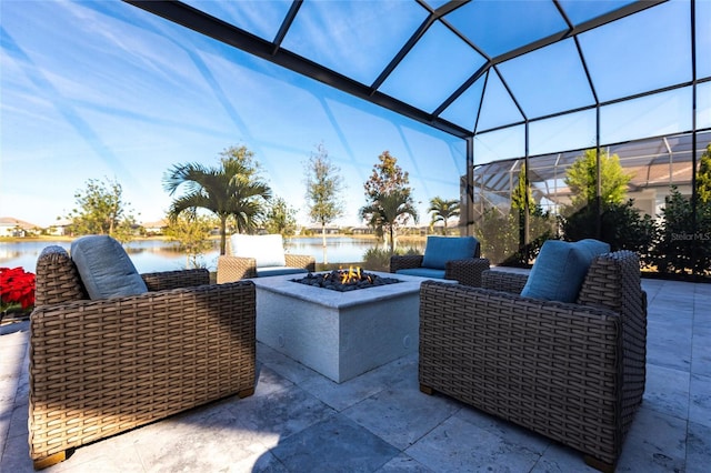 view of patio with a water view and a fire pit