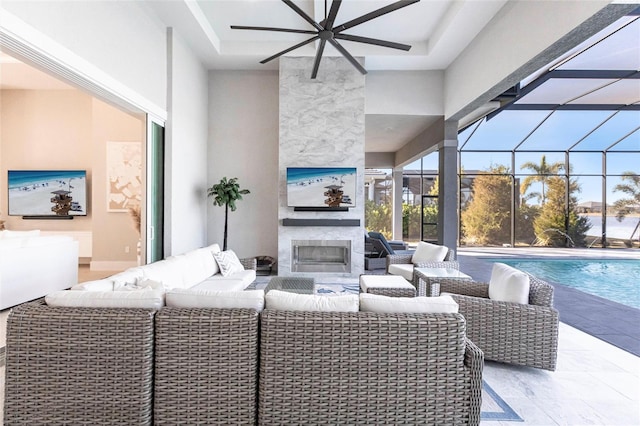 living room with a fireplace and a high ceiling