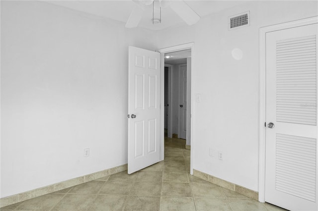 unfurnished room featuring light tile patterned flooring