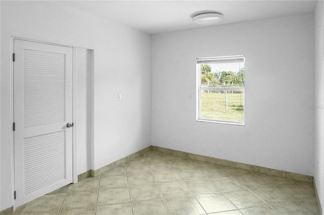 spare room with light tile patterned flooring