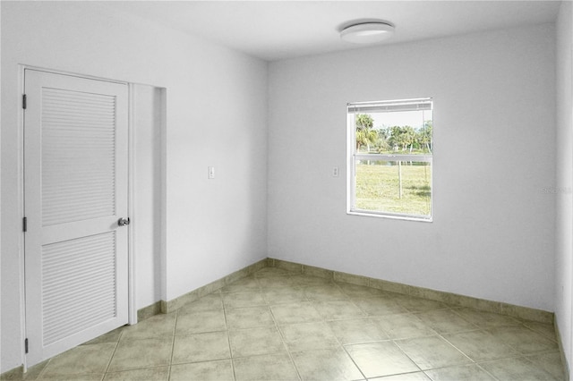 1226 Coral Ridge Dr, Punta Gorda, FL 33950 - empty room with baseboards and light tile patterned floors