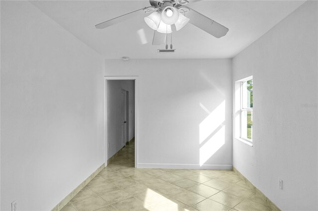 1226 Coral Ridge Dr, Punta Gorda, FL 33950 - unfurnished room with visible vents, baseboards, ceiling fan, and light tile patterned floors