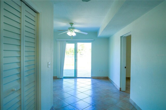 1226 Coral Ridge Dr, Punta Gorda, FL 33950 - tiled spare room featuring baseboards and ceiling fan