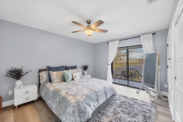 bedroom featuring ceiling fan, hardwood / wood-style floors, and access to outside