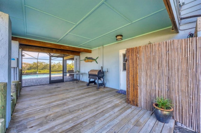 wooden terrace featuring area for grilling