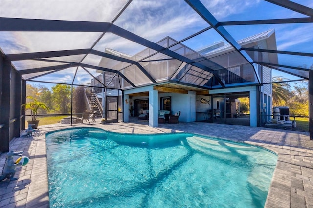 view of pool featuring a lanai and a patio