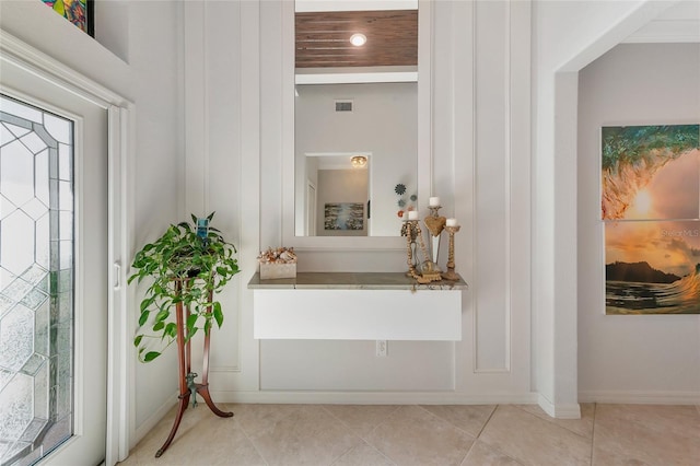 foyer entrance with light tile patterned flooring