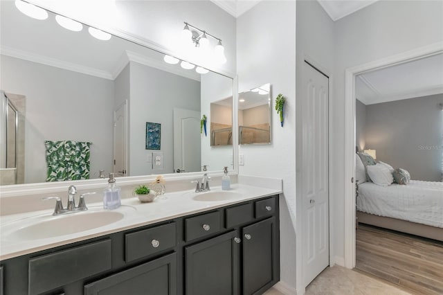 bathroom with ornamental molding and vanity